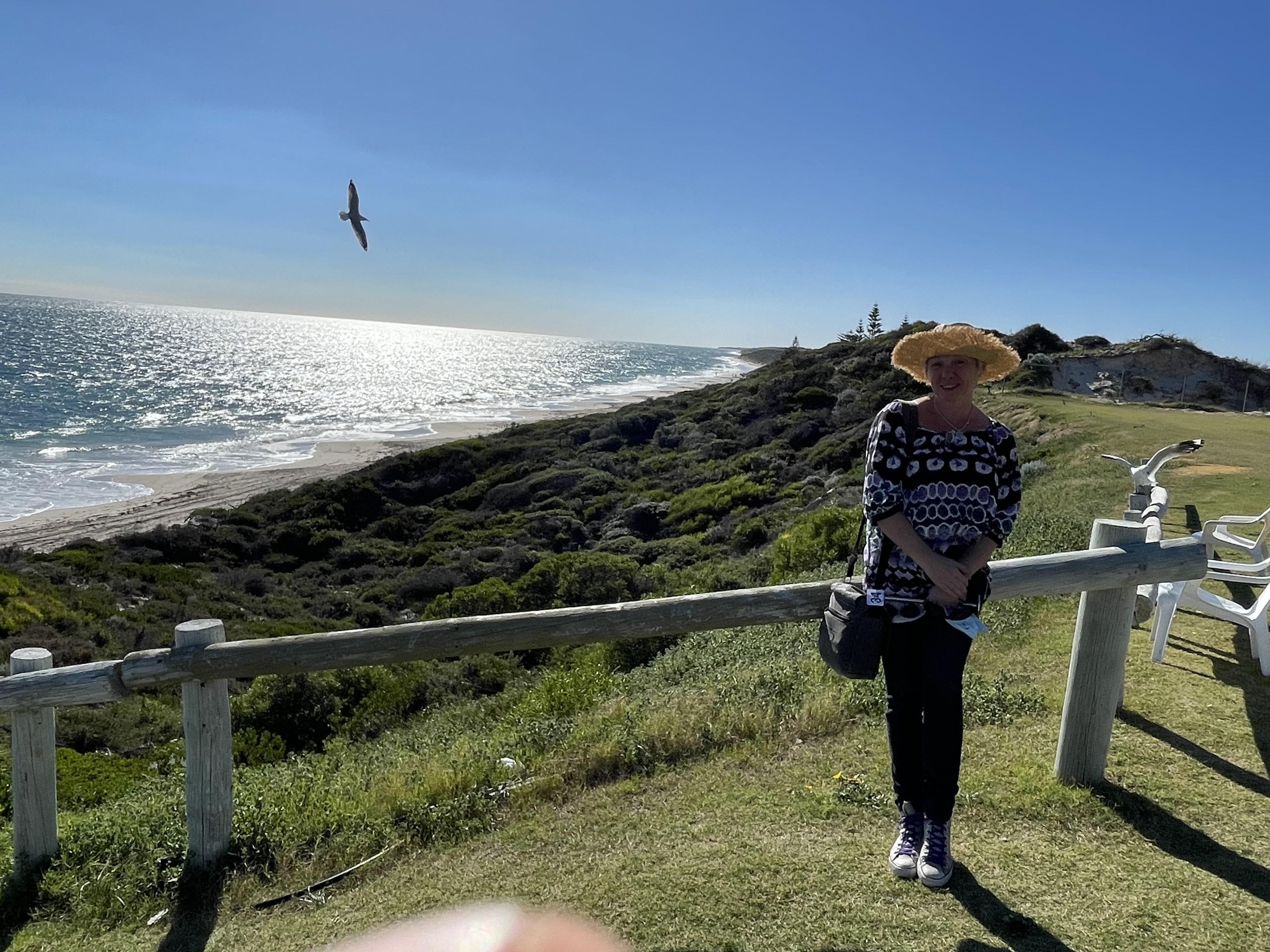 Woman standing near the ocean reflecting on identity, responsibility and carrying everything in midlife. Woman standing near the ocean reflecting on identity, responsibility and carrying everything in midlife.