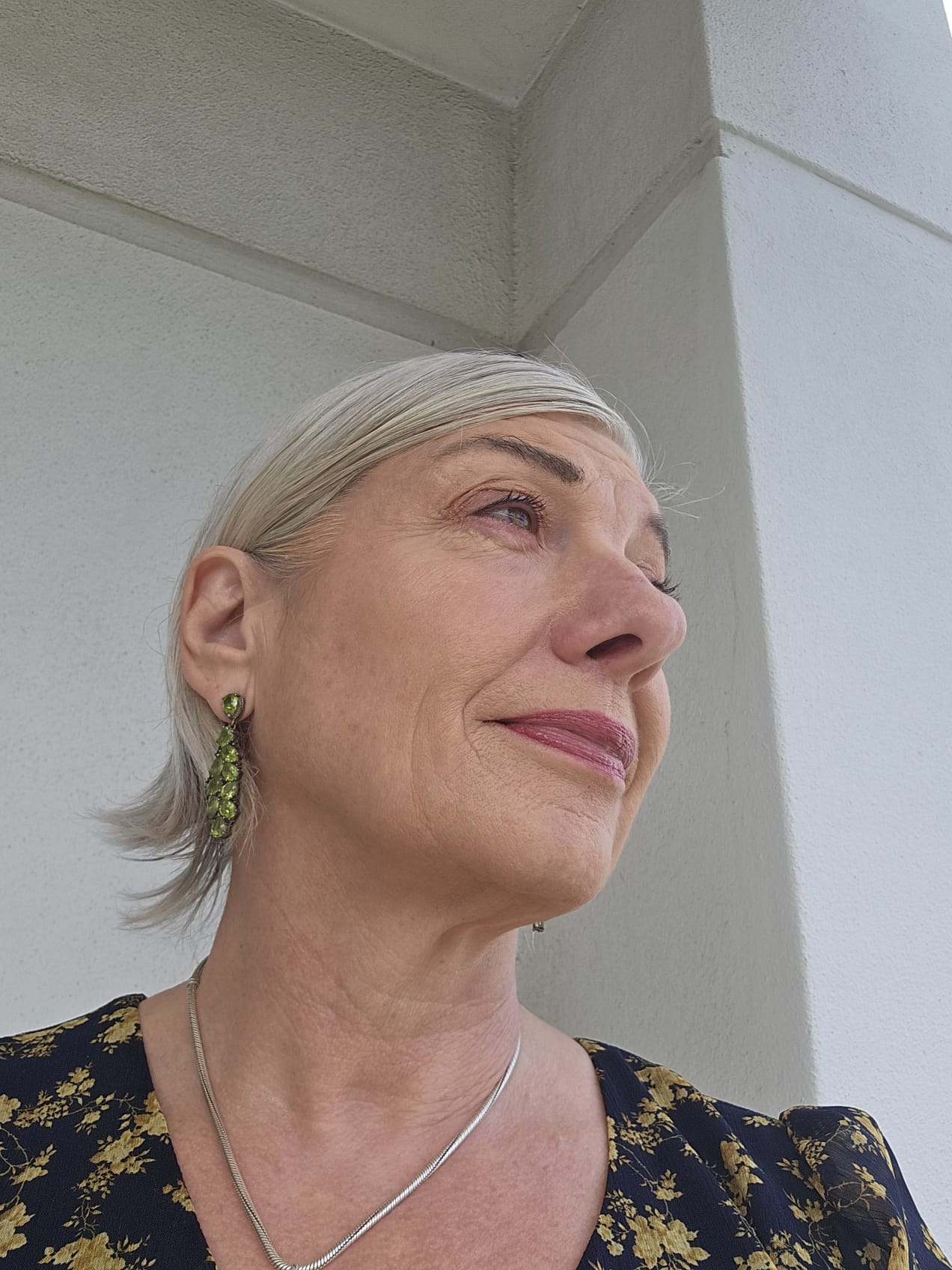 Woman looking into the distance reflecting on when being capable becomes exhausting in midlife. Woman looking into the distance reflecting on when being capable becomes exhausting in midlife.