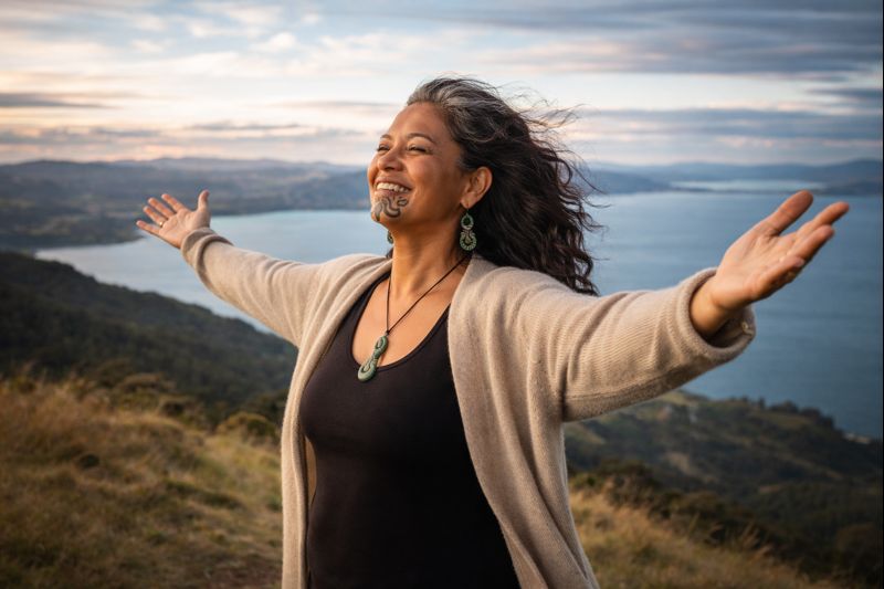 JoyfulWomanEmbrasingSunrise